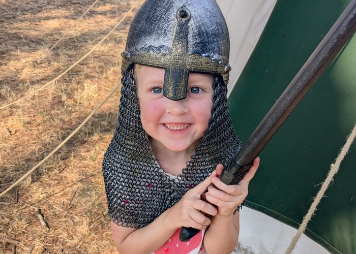 Eloise in a Viking helmet.